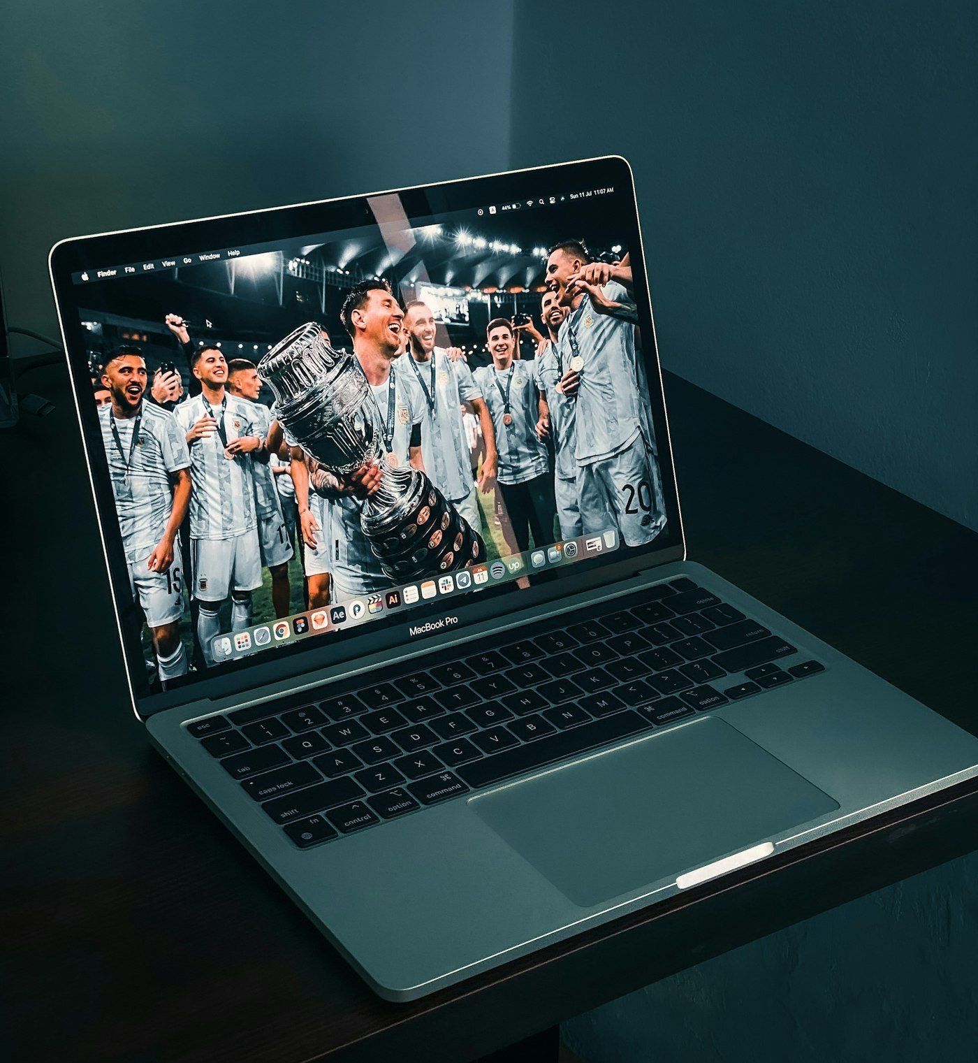 Laptop on a table, representing reviewing a dynasty fantasy football trade value chart